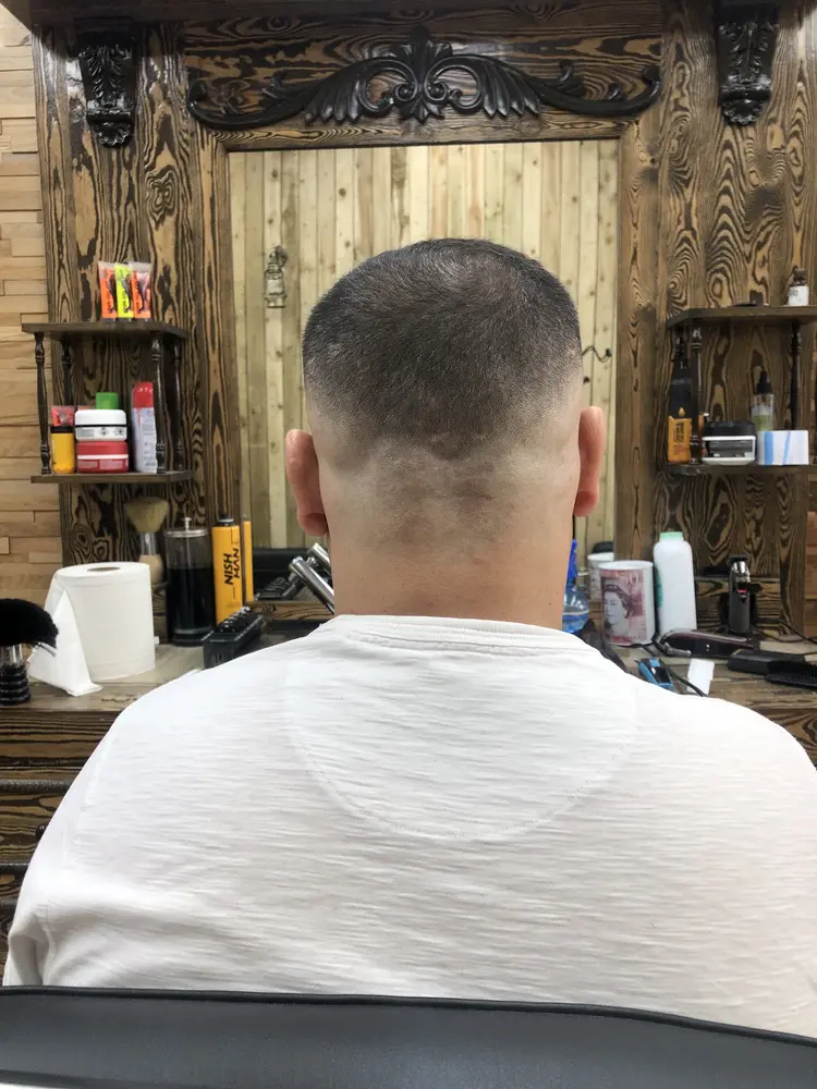Skin fade in front of the carved mirror arch