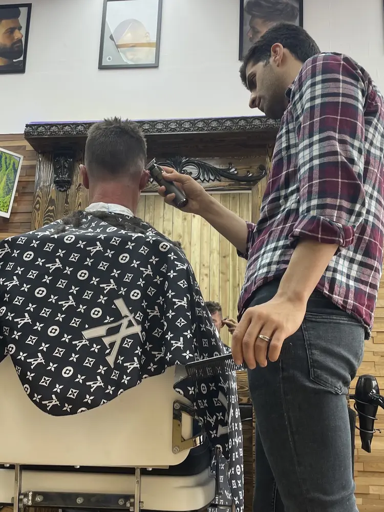 Barber at work in the chair